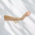 Vergoldeter Armreif mit 10 Ringen
